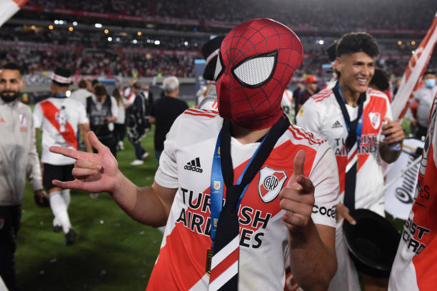 Julian Alvarez of River Plate celebrates winning the championship wearing a Spiderman mask