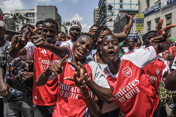 NAIROBI, KENYA - MAY 24: Arsenal supporters wearing jerseys and waving flag gather to celebrate the clubâs Premier League title win, marking its first league championship in 22 years in Nairobi, the capital of Kenya, on May 24, 2026.