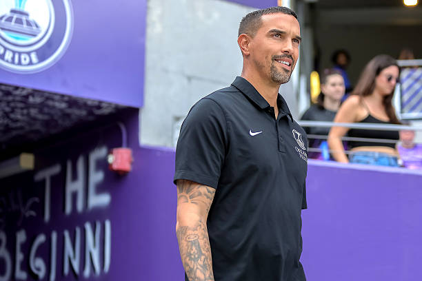 ORLANDO, FLORIDA - MARCH 29: Seb Hines Orlando Pride Head Coach walk out before the start of the match between San Diego Wave FC and Orlando Pride at Inter&Co Stadium on March 29, 2025 in Orlando, Florida. Seb Hines, Orlando Pride