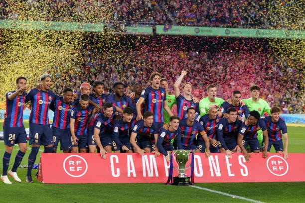 FC Barcelona football clubs with the most trophies BARCELONA, SPAIN - MAY 20: Barcelona's players poses with a Spanish trophy during the celebrations at the end of the Spanish league football match between FC Barcelona vs Real Sociedad at the Camp Nou stadium in Barcelona on May 20, 2023.