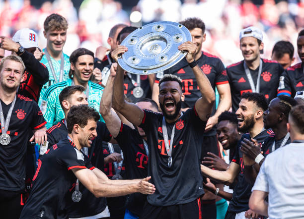 Bayern Munich football clubs with the most COLOGNE, GERMANY - MAY 27: Eric Maxim Choupo-Moting of Muenchen celebrates the winning of the championship at the ceremony after the Bundesliga match between 1.FC Koeln and FC Bayern Muenchen at RheinEnergieStadion on May 27, 2023 in Cologne, Germany.trophies