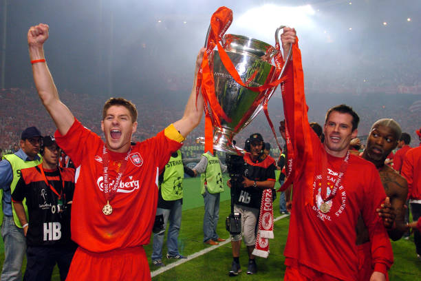 Liverpool vs. AC Milan (2005) best Champions League finals Liverpool's Steven Gerrard, Jamie Carragher and Djibril Cisse celebrate with the UEFA Champions League trophy