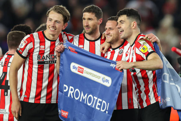Sheffield United newly promoted EPL teams for the 2023/24 season APRIL 26: Sander Berge, Chris Basham, Billy Sharp and John Egan of Sheffield United celebrate promotion to the premier league after the Sky Bet Championship between Sheffield United and West Bromwich Albion at Bramall Lane on April 26, 2023 in Sheffield, United Kingdom.