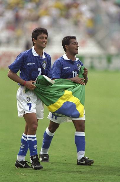 Bebeto & Romario best duos in soccer history 7 Sep 1994: Bebeto and Romario of Brazil hold the Brazilian flag after their victory in the World Cup match against Holland at the Cotton Bowl in Dallas, Texas, USA. Brazil won the match 3-2. 