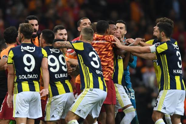 Fenerbahce vs. Galatasaray top rivalries in soccer history Fenerbahce and Galatasaray players fight at the end of the Turkish Spor Toto Super league fotball match between Galatasaray and Fenerbahce on November 2, 2018 at TT Ali Samiyen sport complex in Istanbul.