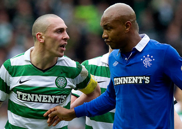Celtic vs. Rangers best rivalries in soccer history 06/02/11 SCOTTISH CUP 5TH RND.RANGERS v CELTIC (2-2).IBROX - GLASGOW.Celtic captain Scott Brown has plenty to say to El Hadji Diouf (right) 