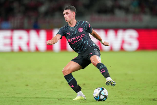 Phil Foden footballers with the best first touch TOKYO, JAPAN - JULY 26: Phil Foden of Manchester City controls the ball during the preseason friendly match between Manchester City and Bayern Muenchen at National Stadium on July 26, 2023 in Tokyo, Japan.