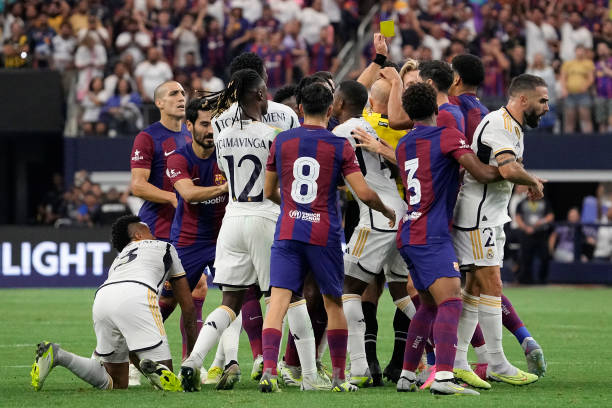 Barcelona vs. Real Madrid best soccer rivalries in the world ARLINGTON, TEXAS - JULY 29: Players scuffle after Frenkie de Jong #21 of FC Barcelona is shown a yellow card during the first half of the pre-season friendly match against Real Madrid at AT&T Stadium on July 29, 2023 in Arlington, Texas.