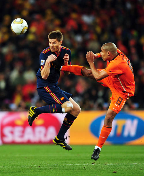 Nigel de Jong most aggressive soccer players of all time JOHANNESBURG, SOUTH AFRICA - JULY 11:  Xabi Alonso of Spain (L) is fouled by Nigel De Jong of the Netherlands during the 2010 FIFA World Cup South Africa Final match between Netherlands and Spain at Soccer City Stadium on July 11, 2010 in Johannesburg, South Africa