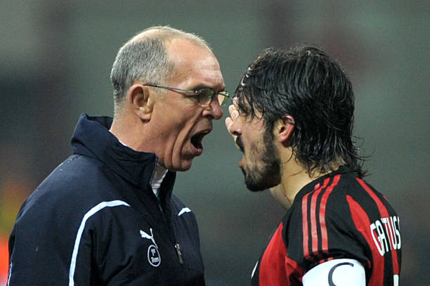 Gennaro Gattuso most aggressive soccer players of all time AC Milan's midfielder Gennaro Ivan Gattuso (R) argues with Tottenham's assistant coach Joe Jordan during their Champions League match on February 15, 2011 in San Siro Stadium in Milan. AFP PHOTO / GIUSEPPE CACACE