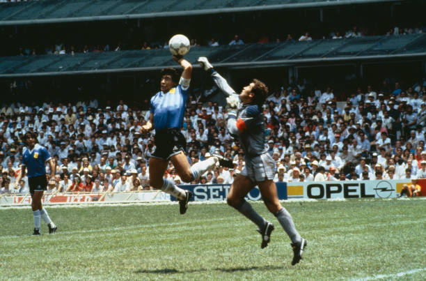 Diego Maradona Hand of god goal vs. England Most Controversial goals in soccer history Sport, Football, 1986 Football World Cup, Mexico, Quarter Final, Argentina 2 v England 1, 22nd June, 1986, Argentina's Diego Maradona scores 1st goal with his Hand of God, past England goalkeeper Peter Shilton