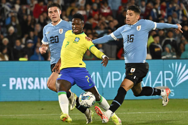 Best 6 Players to Watch at Copa America MONTEVIDEO, URUGUAY - OCTOBER 17: Manuel Ugarte (L) and Mathias Olivera (R) of Uruguay compete for the ball with Vinicius Jr. of Brazil during the FIFA World Cup 2026 Qualifier match between Uruguay and Brazil at Centenario Stadium on October 17, 2023 in Montevideo, Uruguay.