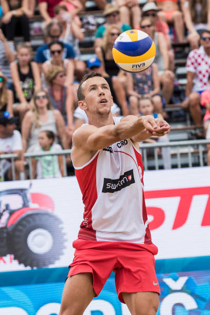 Ivan Perisic - Beach Volleyball POREC, CROATIA - JUNE 30: Ivan Perisic of Croatia and Inter Milan receives the ball during the match against Jake Gibb and Taylor Crabb of the United States during the second stage of the Swatch Beach Volleyball Major Series on June 30, 2017 in Porec, Croatia. 