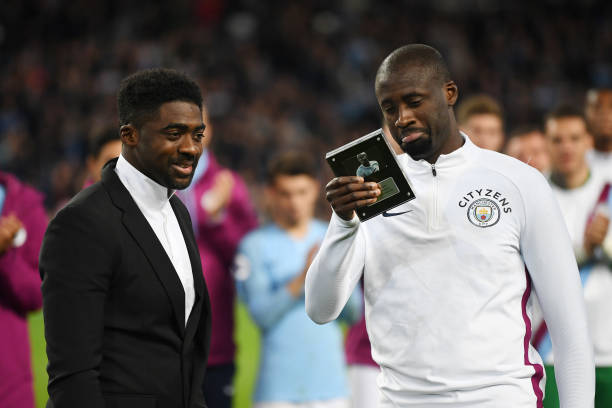 MANCHESTER, ENGLAND - MAY 09: Yaya Toure of Manchester City shows appreciation to the fans as his brother Kolo Toure looks on during the Premier League match between Manchester City and Brighton and Hove Albion at Etihad Stadium on May 9, 2018 in Manchester, England.