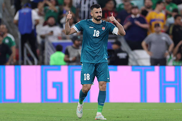 Iraq's forward #18 Aymen Hussein celebrates scoring his team's second goal during the 2026 FIFA World Cup qualifiers final playoff football match between Iraq and Bolivia at the BBVA Stadium in Guadalupe, Nuevo Leon state, Mexico, on March 31, 2026.