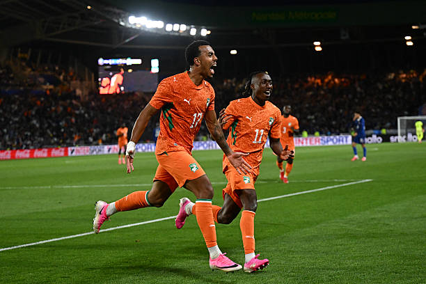 Ivory Coast's defender #17 Guela Doue celebrates scoring the equalizing goal during the international friendly football match between France and Ivory Coast ahead of the 2026 FIFA World Cup football tournament at the Stade de la Beaujoire in Nantes, western France, on June 4, 2026.