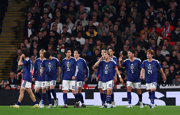 LONDON, ENGLAND - MARCH 31: Kaoru Mitoma of Japan celebrates scoring his team's first goal with teammates during the international friendly match between England and Japan at Wembley Stadium on March 31, 2026 in London, England.
