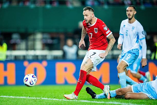 Austria's forward #07 Marko Arnautovic (L) scores the 10:0 goal during the FIFA World Cup 2026 Group H European qualification football match Austria vs San Marino in Vienna, Austria, on October 9, 2025.