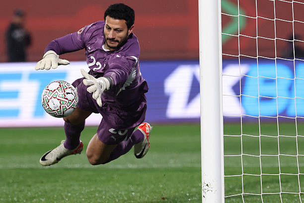 Egypt's goalkeeper #23 Mohamed El Shenawy makes a save during the Africa Cup of Nations (CAN) quarter-final football match between Egypt and Ivory Coast at the Grand stadium in Agadir on January 10, 2026.