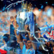 MANCHESTER, ENGLAND - MAY 13: Scorer of the matchwinning goal Sergio Aguero of Manchester City celebrates with the trophy during the Barclays Premier League match between Manchester City and Queens Park Rangers at the Etihad Stadium on May 13, 2012 in Manchester, England.