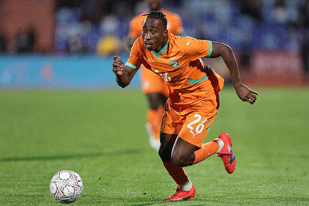 Ivory Coast's forward #26 Yan Diomande runs with the ball during the Africa Cup of Nations (CAN) round of 16 football match between Ivory Coast and Burkina Faso at the Grand Stadium in Marrakesh on January 6, 2026.