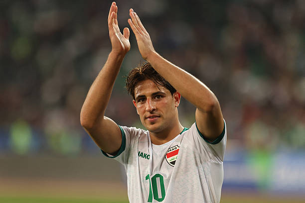 Iraq's forward #10 Mohanad Ali greets the fans after the 2026 FIFA World Cup AFC qualifiers football match between Iraq and the Philippines at the Basra International Stadium in Iraq on March 21, 2024.